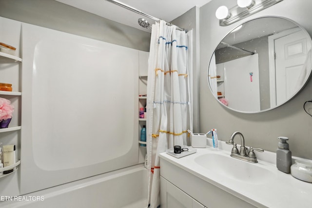 bathroom featuring shower / bathtub combination with curtain and vanity