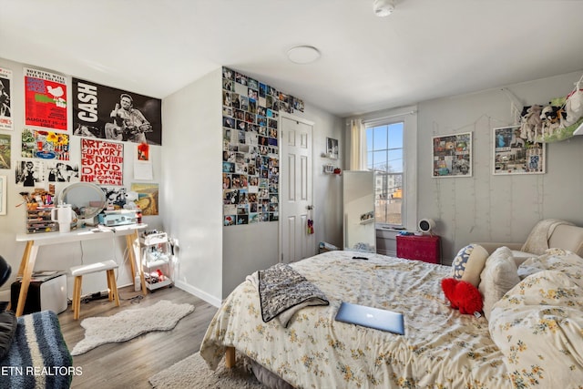 bedroom with wood finished floors