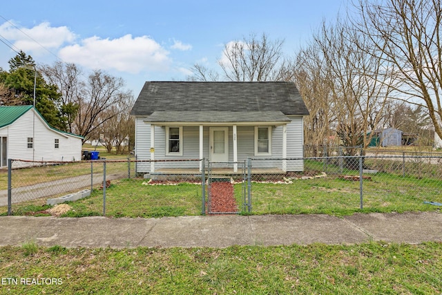 bungalow-style house with a fenced front yard, roof with shingles, a front yard, covered porch, and a gate