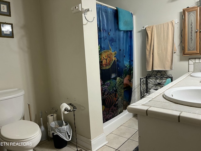 bathroom featuring a shower with curtain, vanity, toilet, and tile patterned flooring