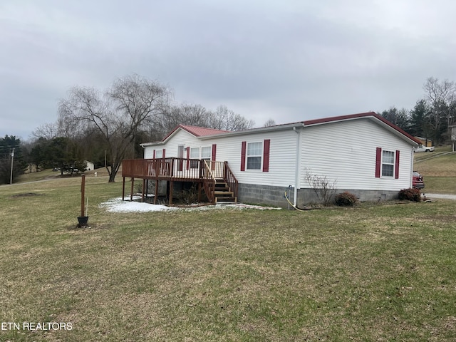 view of front of property featuring stairway, a front lawn, and a deck