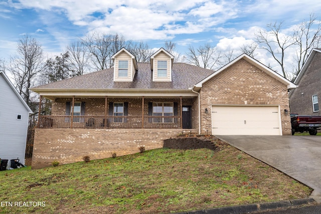 view of front facade featuring a garage and a porch