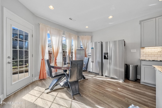 dining area with light wood-type flooring