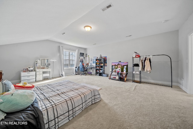 carpeted bedroom featuring lofted ceiling