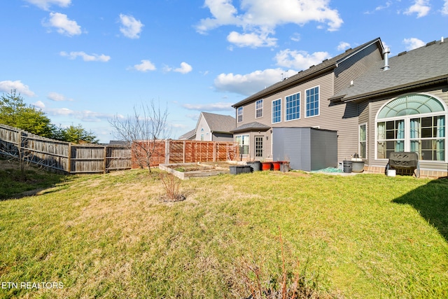 rear view of property featuring a yard