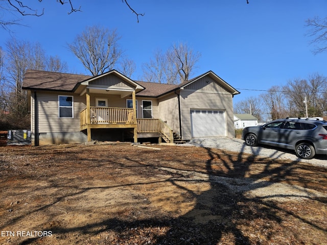 view of front of home with a garage and a porch