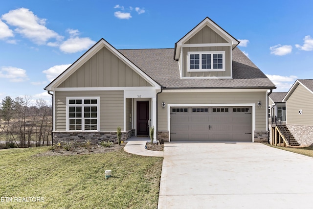 craftsman inspired home featuring a garage and a front yard