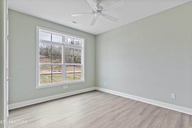 unfurnished room with ceiling fan and light hardwood / wood-style flooring