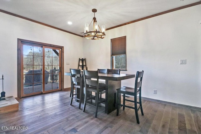 dining area with crown molding, dark hardwood / wood-style floors, and a notable chandelier