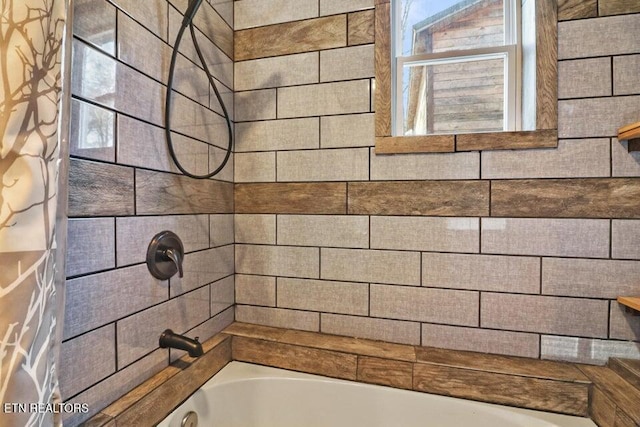 bathroom featuring shower / bath combo with shower curtain