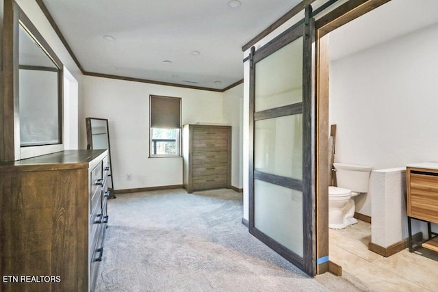 bathroom with ornamental molding and toilet