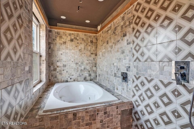 bathroom featuring tiled tub