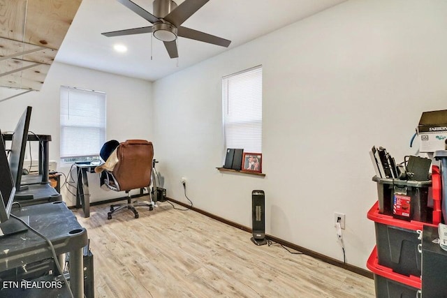 office area with hardwood / wood-style flooring and ceiling fan