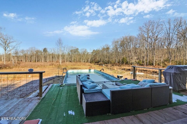 deck with a pool and an outdoor living space