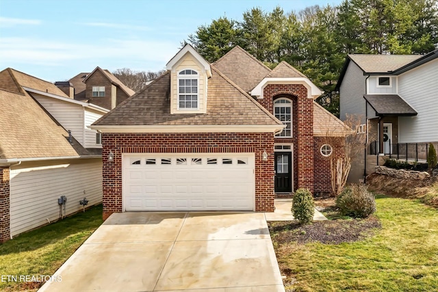 front facade featuring a garage and a front yard