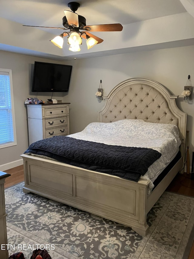 bedroom with ceiling fan and wood-type flooring