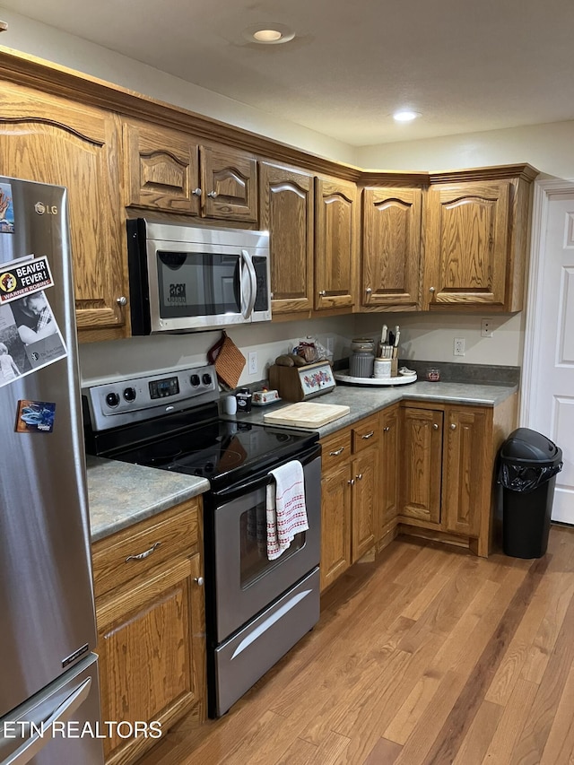 kitchen featuring light hardwood / wood-style flooring and stainless steel appliances