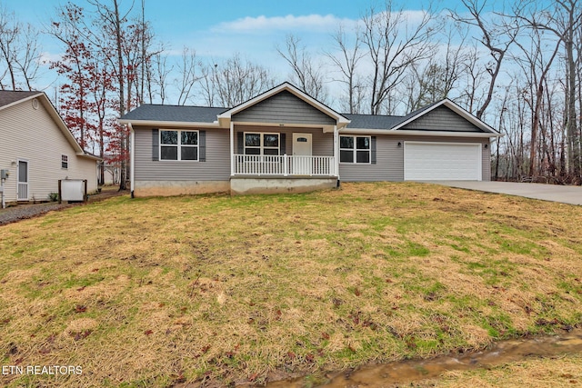 single story home with a garage, a front lawn, and covered porch