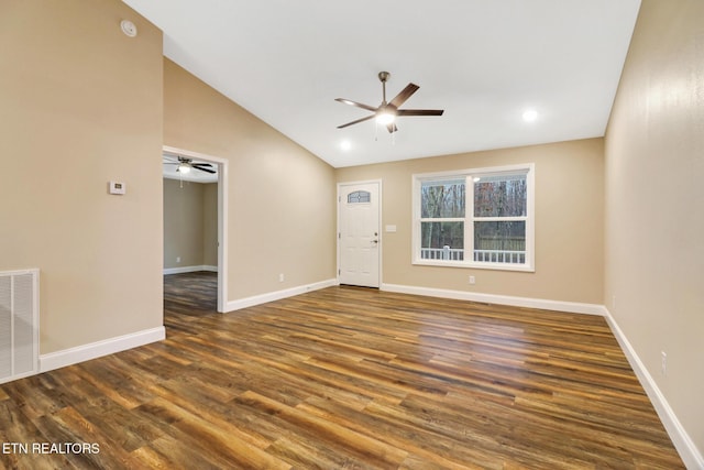 interior space with ceiling fan, lofted ceiling, and dark hardwood / wood-style floors