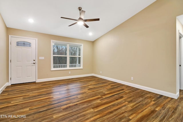 entrance foyer with lofted ceiling, dark hardwood / wood-style floors, and ceiling fan