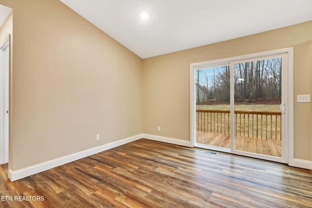 spare room with hardwood / wood-style flooring