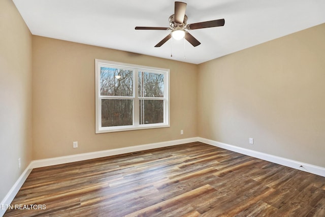 spare room featuring hardwood / wood-style flooring and ceiling fan