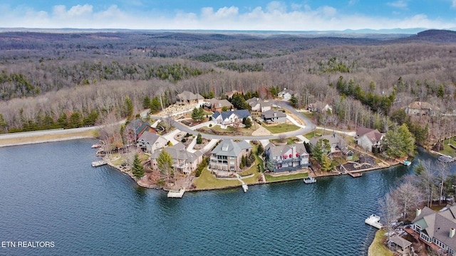 drone / aerial view featuring a residential view and a water view