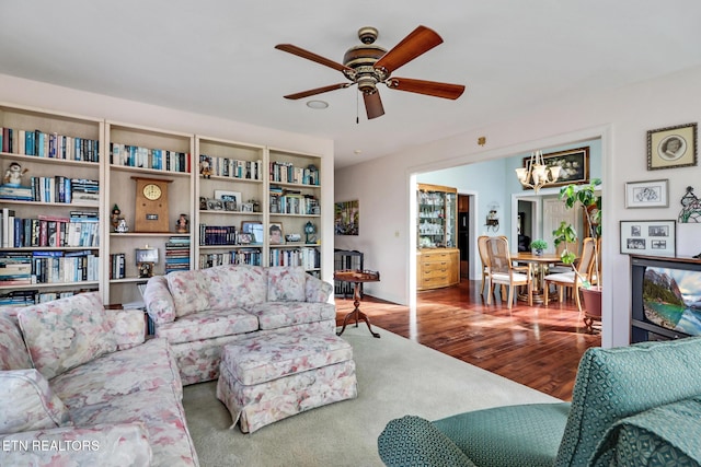 living area featuring ceiling fan and wood finished floors