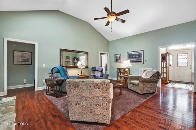 living room with dark wood-type flooring, high vaulted ceiling, baseboards, and a ceiling fan