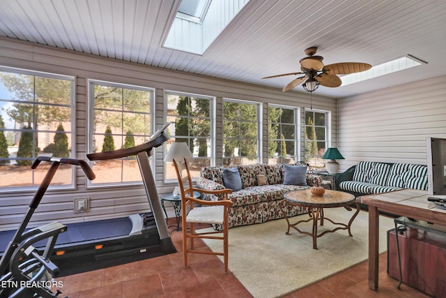 sunroom featuring a skylight and ceiling fan