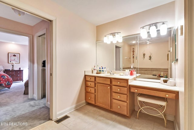 bathroom with baseboards, visible vents, connected bathroom, tile patterned floors, and vanity