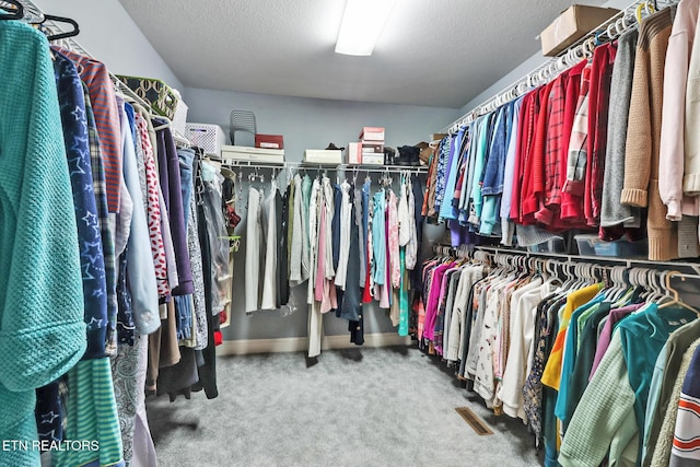 spacious closet featuring carpet and visible vents