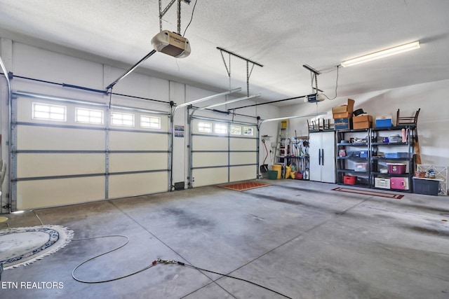 garage featuring a garage door opener