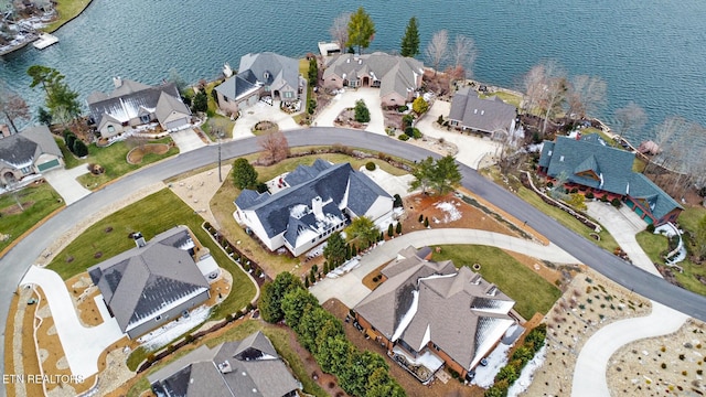 aerial view featuring a water view and a residential view