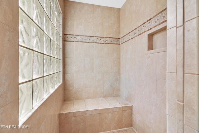 full bathroom with tiled shower