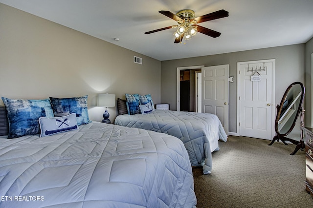 bedroom featuring baseboards, visible vents, ceiling fan, and carpet floors