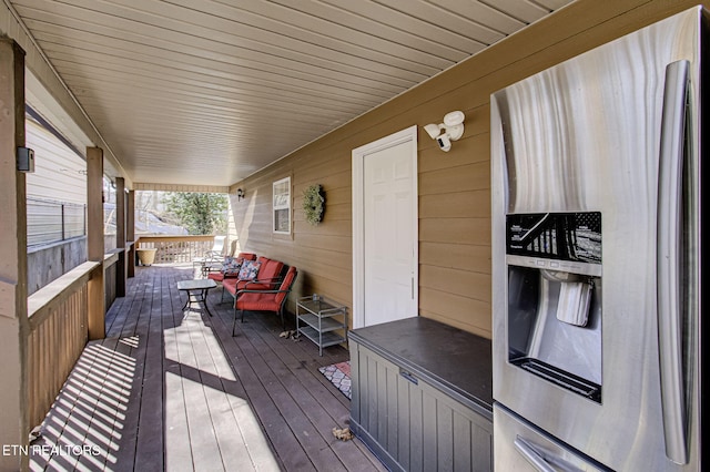 wooden terrace with a porch