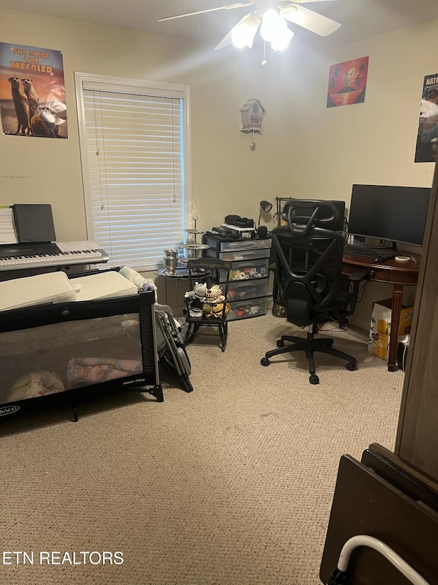 home office featuring ceiling fan and carpet floors