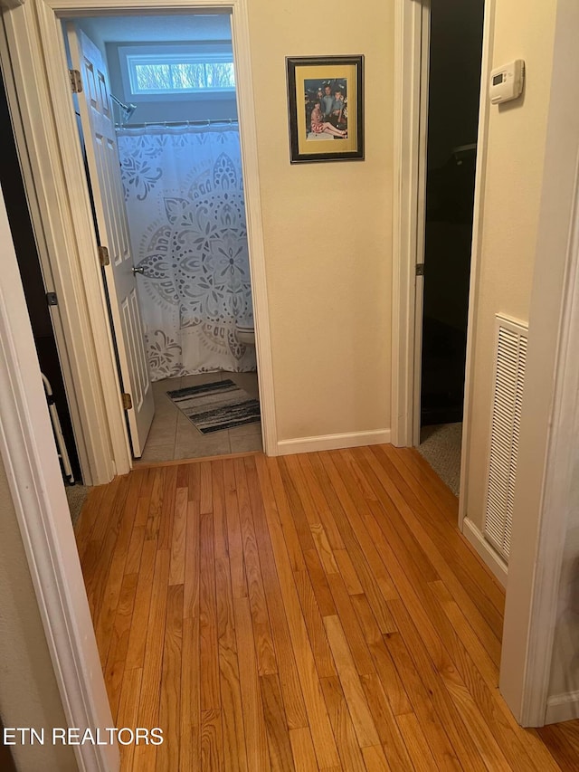 hallway featuring light hardwood / wood-style floors