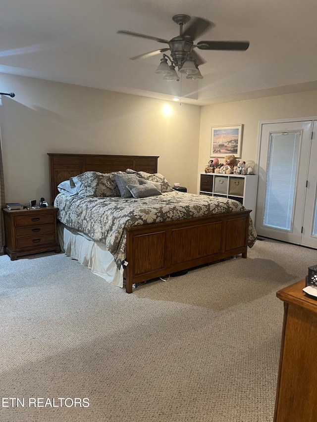 bedroom featuring light carpet and ceiling fan