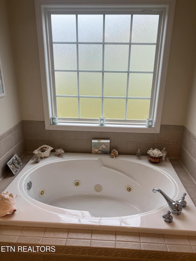 bathroom featuring tiled bath