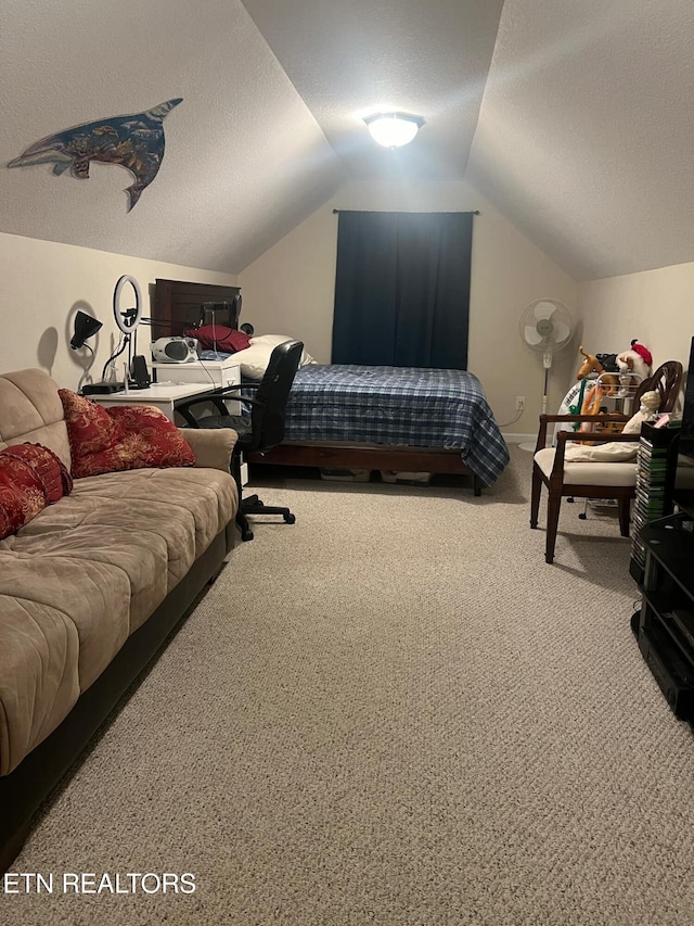 carpeted bedroom featuring lofted ceiling and a textured ceiling