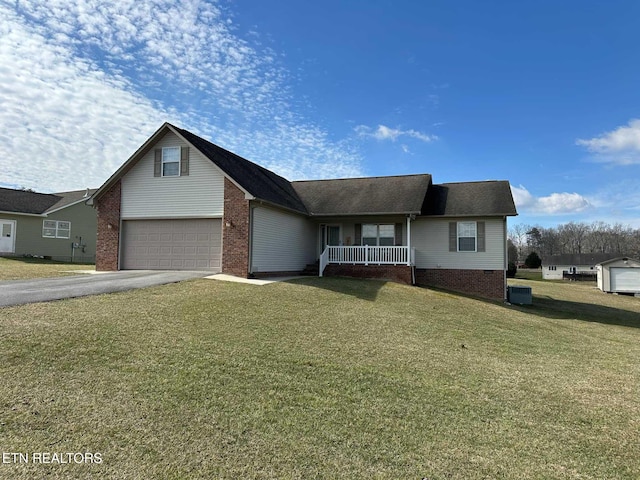 view of front of property featuring aphalt driveway, brick siding, a porch, a front yard, and crawl space