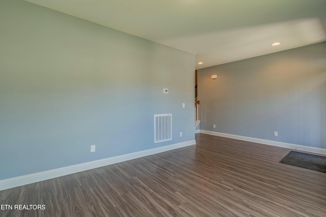 empty room featuring dark wood-type flooring