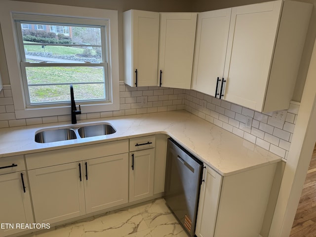 kitchen featuring white cabinets, sink, dishwasher, and light stone countertops