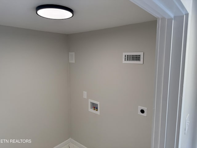 washroom with electric dryer hookup and hookup for a washing machine