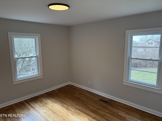 empty room featuring hardwood / wood-style floors