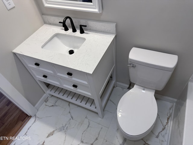 bathroom with toilet and vanity