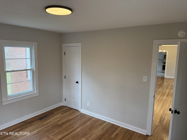 empty room featuring hardwood / wood-style flooring