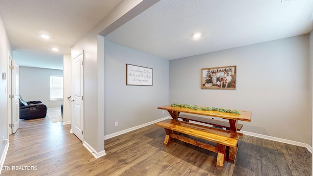 dining space featuring wood-type flooring